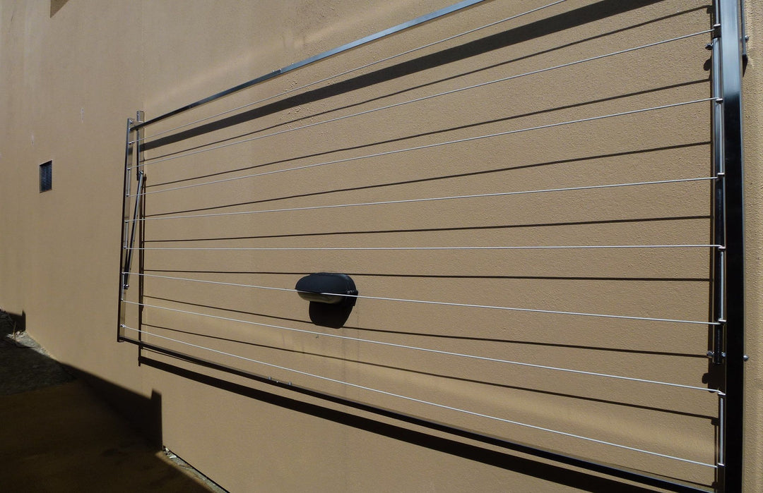 316 stainless steel clothesline wall mounted to fence in down position