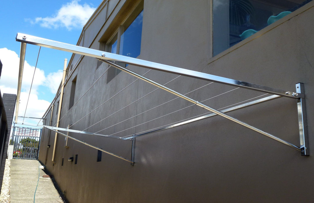 316 stainless steel clothesline mounted to brick wall