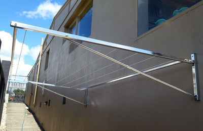 316 stainless steel clothesline mounted to brick wall